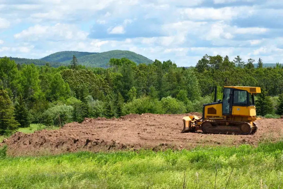 Equipment staged on a cleared property